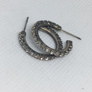 Gold diamond studded hoops.